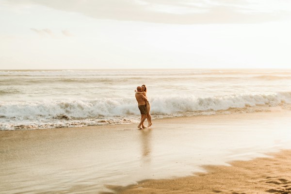 Sample photo of a couple on a beach, flagged for private review in this simulation